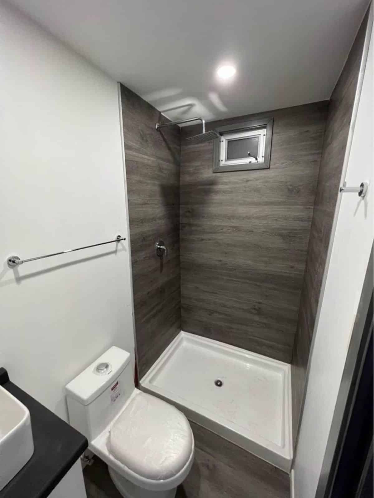 full length shower area in bathroom of AirBnB container home