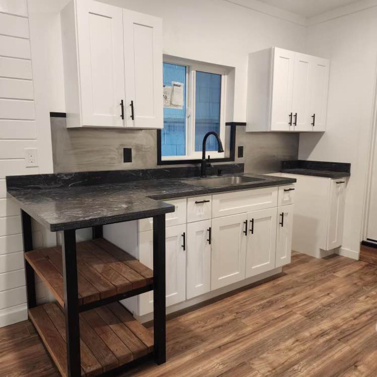 huge kitchen countertop with storage cabinets of beautiful container home