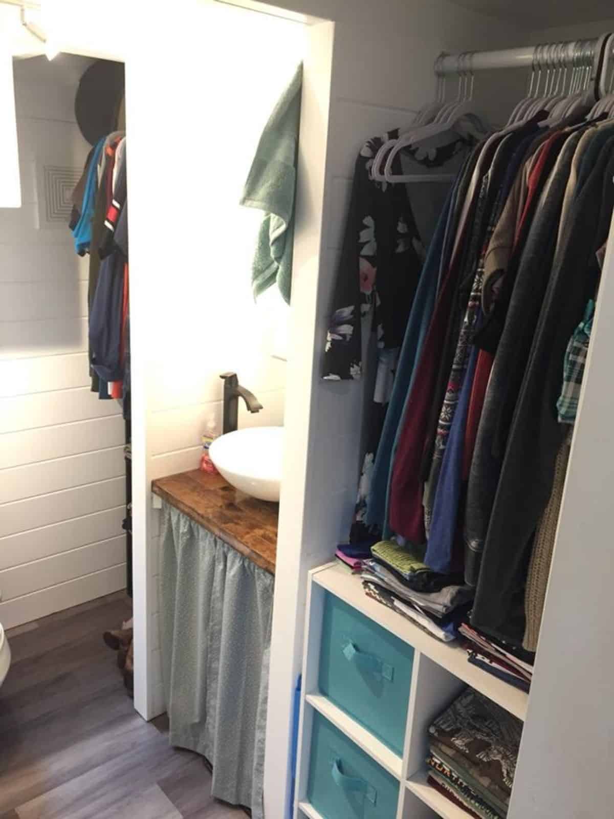 sink with vanity and separate closet of Noah certified tiny house