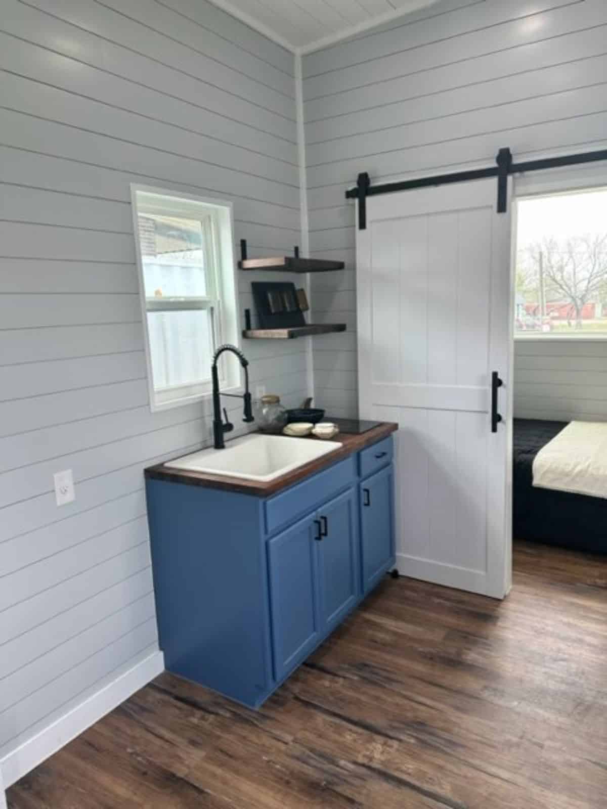 kitchen area of one bedroom tiny home is very compact but can be redesign with a big 1