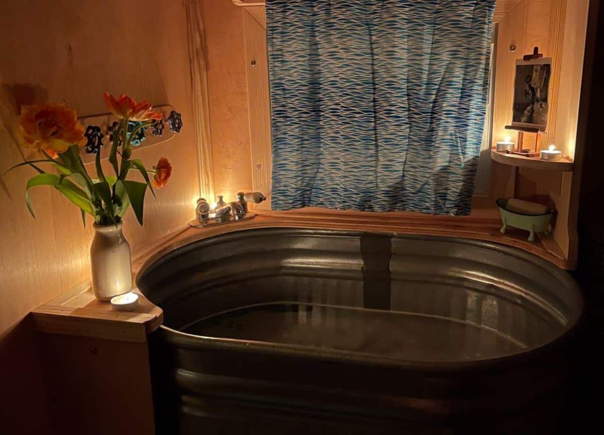 3 foot long bathtub in bathroom of rare custom built tiny home