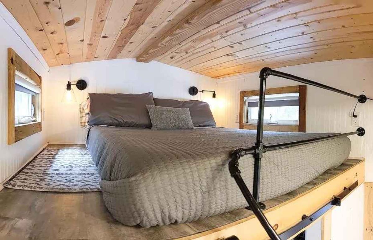 loft bedroom has a comfortable queen mattress and an ample space to keep other items