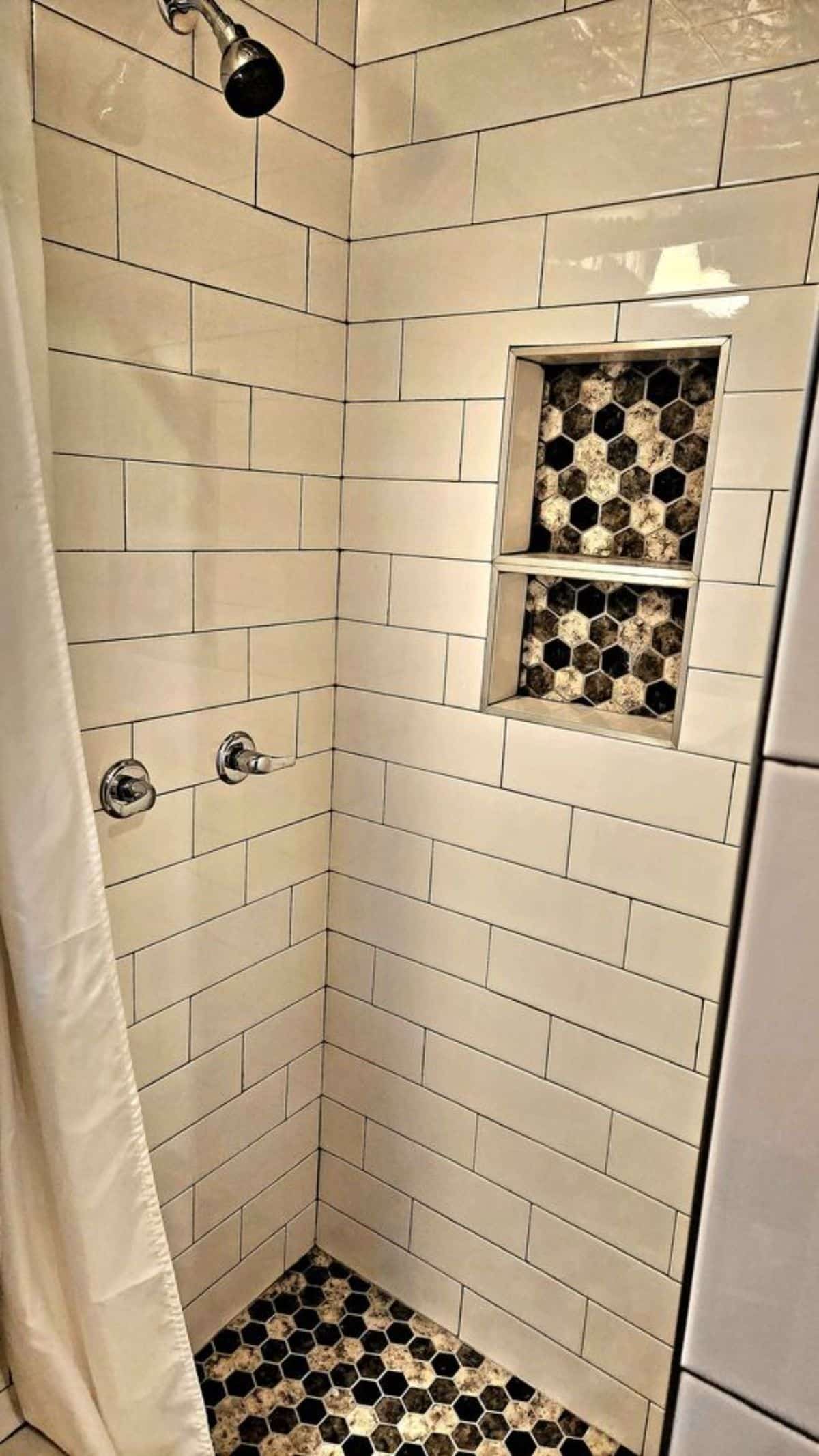 full length shower area with rain shower in bathroom