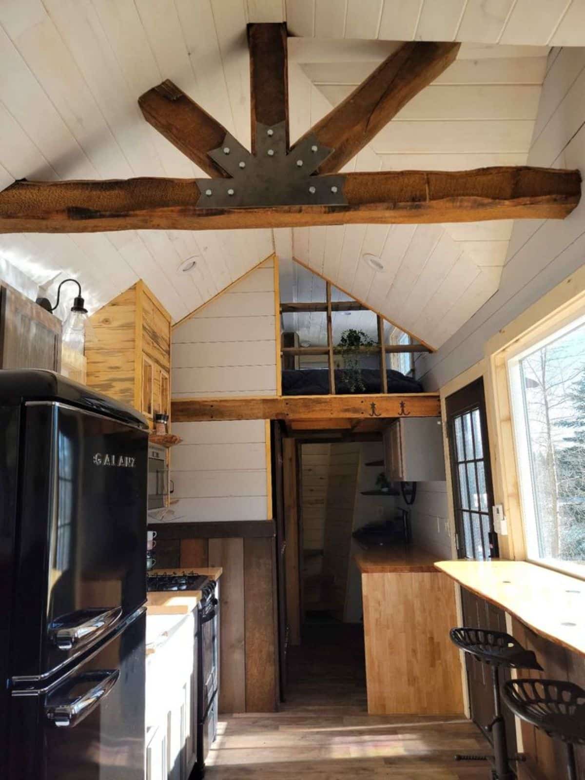 full length wooden interiors of 1 bedroom tiny house