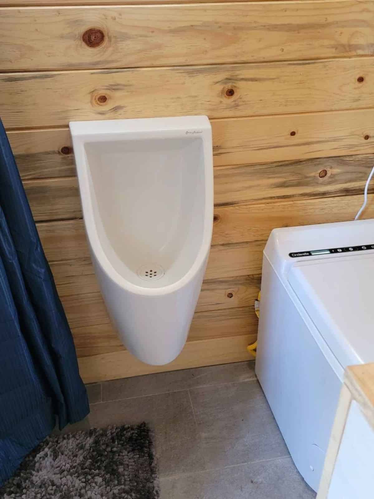 waterless urinal installed in bathroom