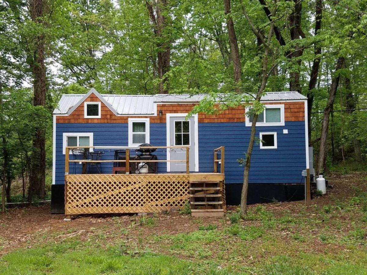 main entrance and stunning glue exterior of 2 bedroom tiny home