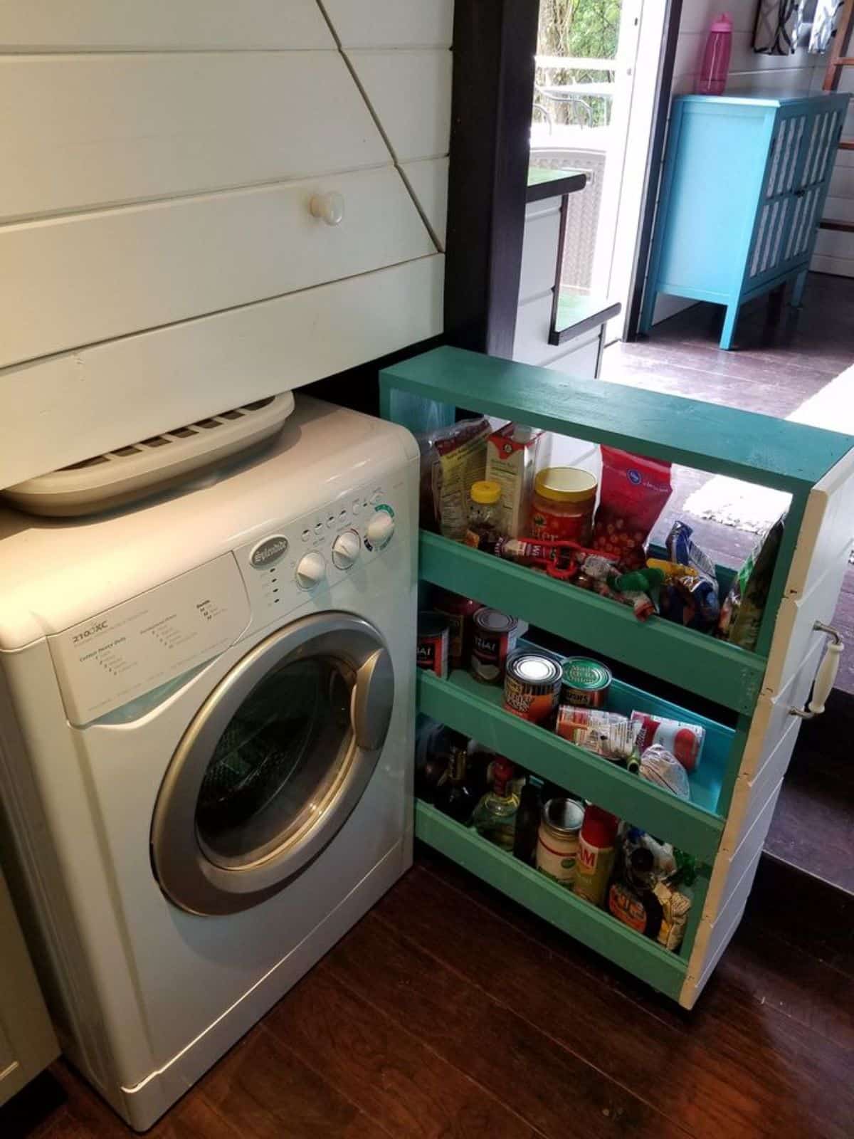 washer dryer combo is also installed in the kitchen area