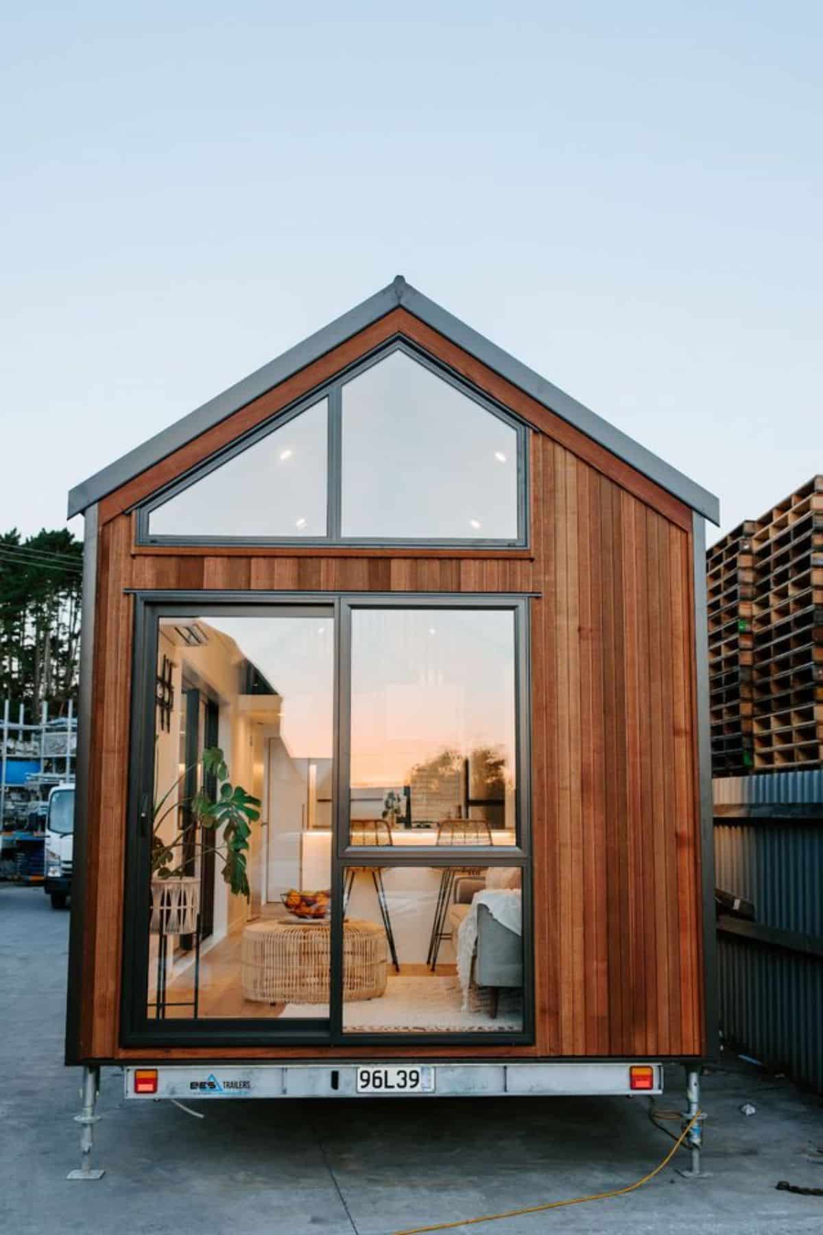 glass door view of 2 bedroom tiny house from outside