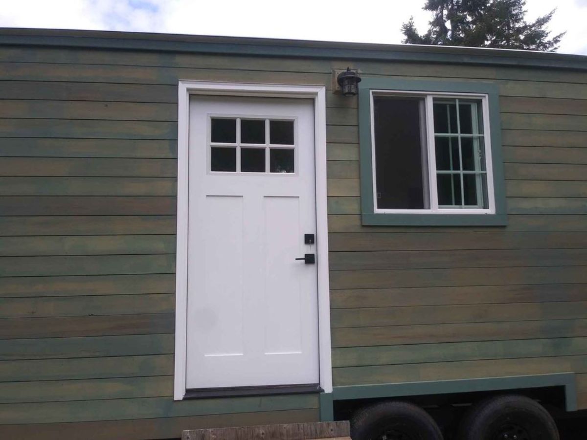 main entrance door view of 20’ cottage tiny house