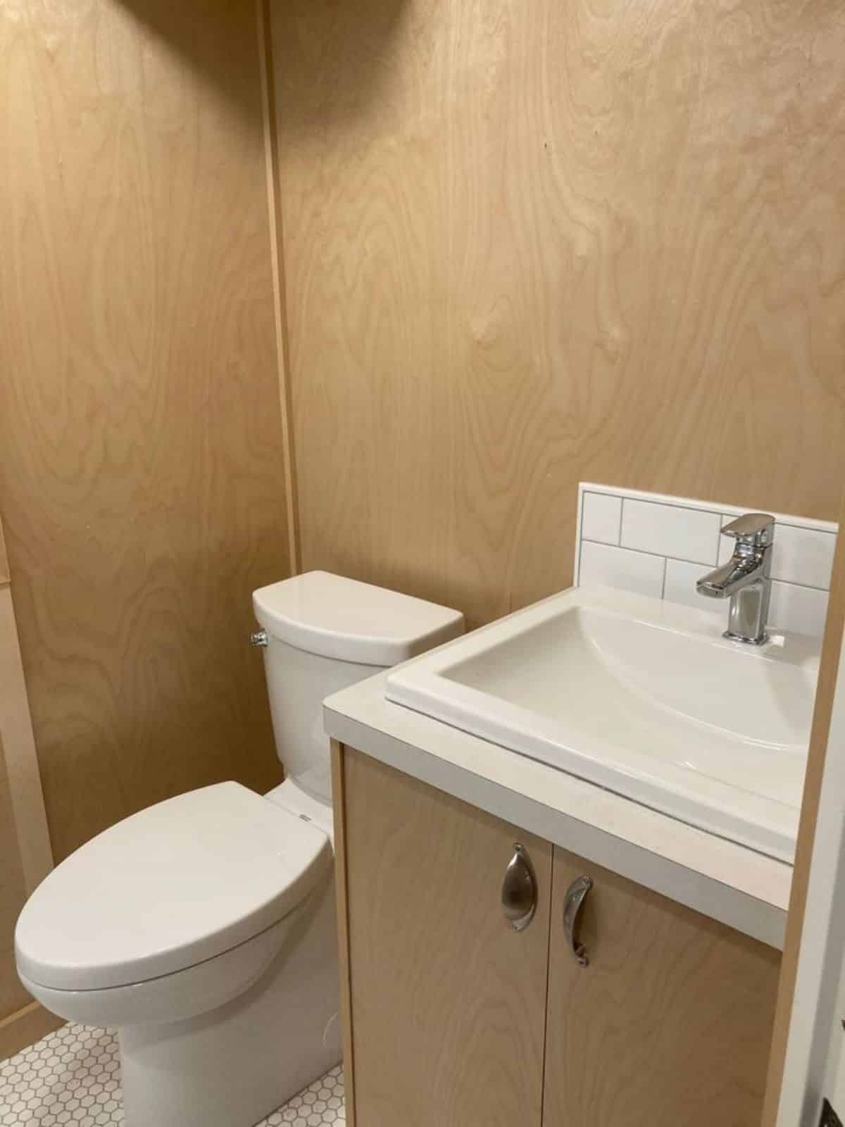 standard fittings in bathroom of 24’ custom tiny home