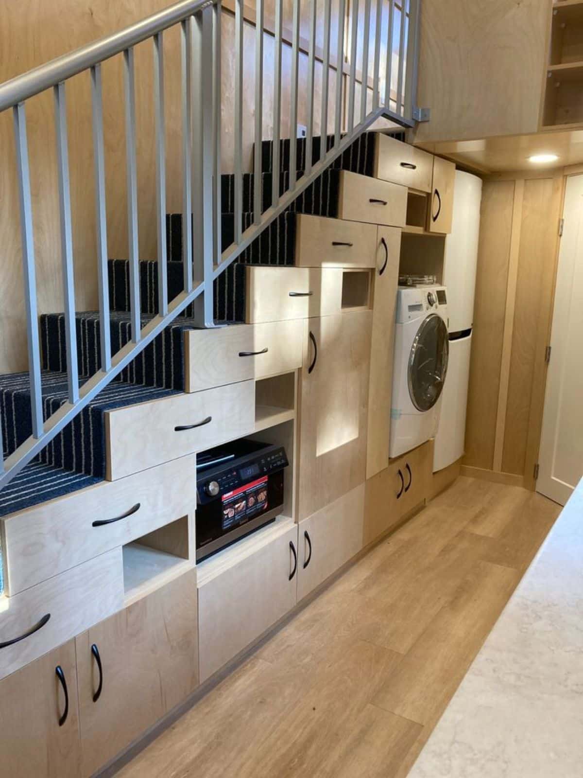 multi purpose stairs with storage cabinets leading to the loft