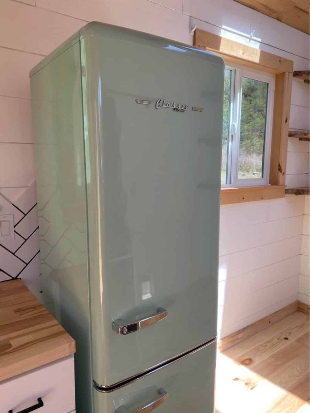 double door refrigerator in kitchen area of 24’ NOAH certified tiny house