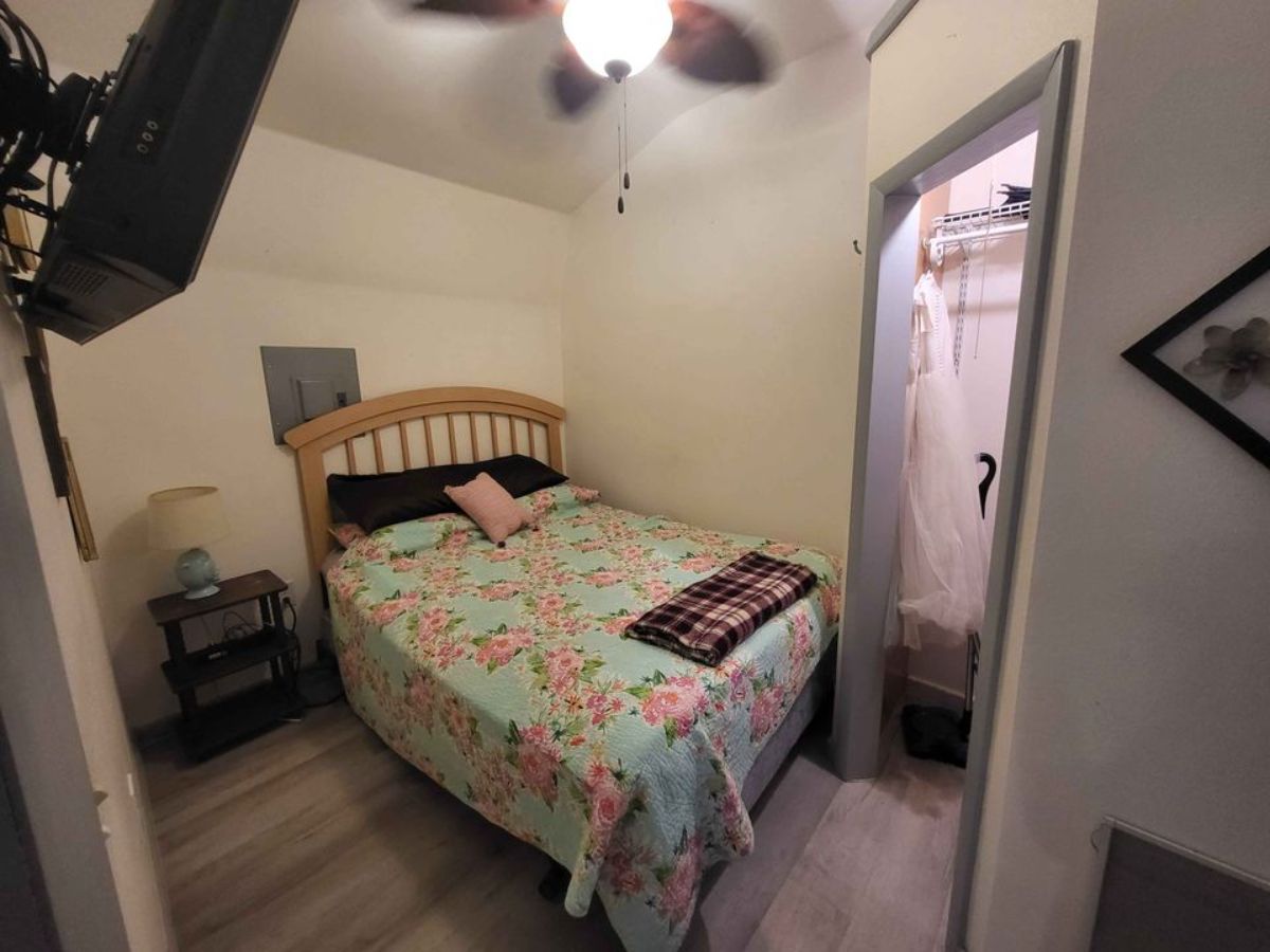 small table besides the bed in the bedroom can be removed