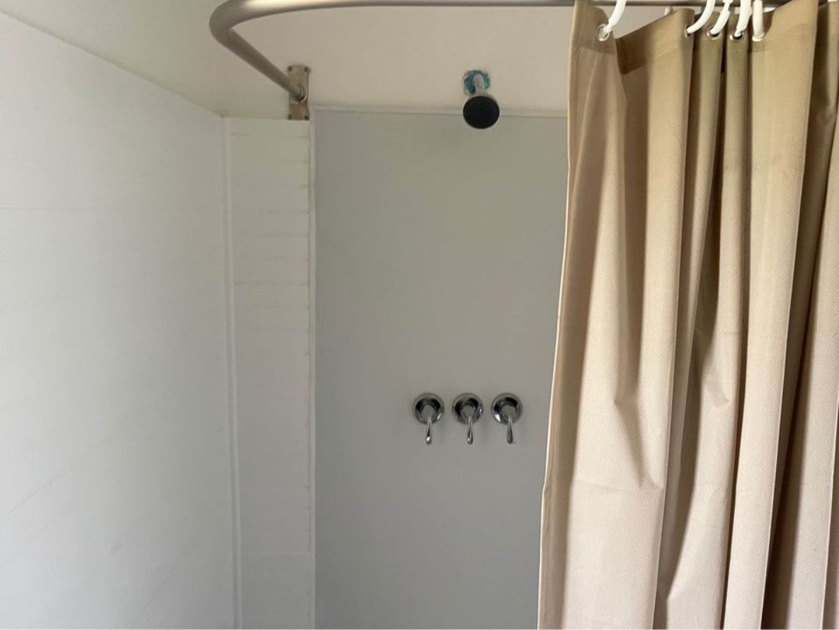 full length shower area in bathroom of beautiful tiny home