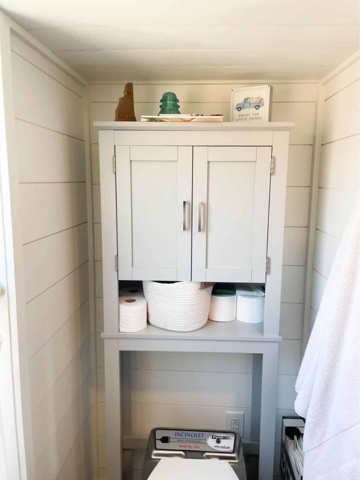 bathroom of minimalist tiny home has all the standard fittings