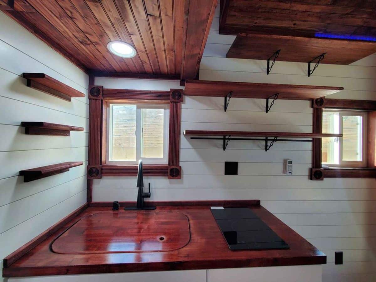 compact yet stylish kitchen area of 24' tiny home on wheels
