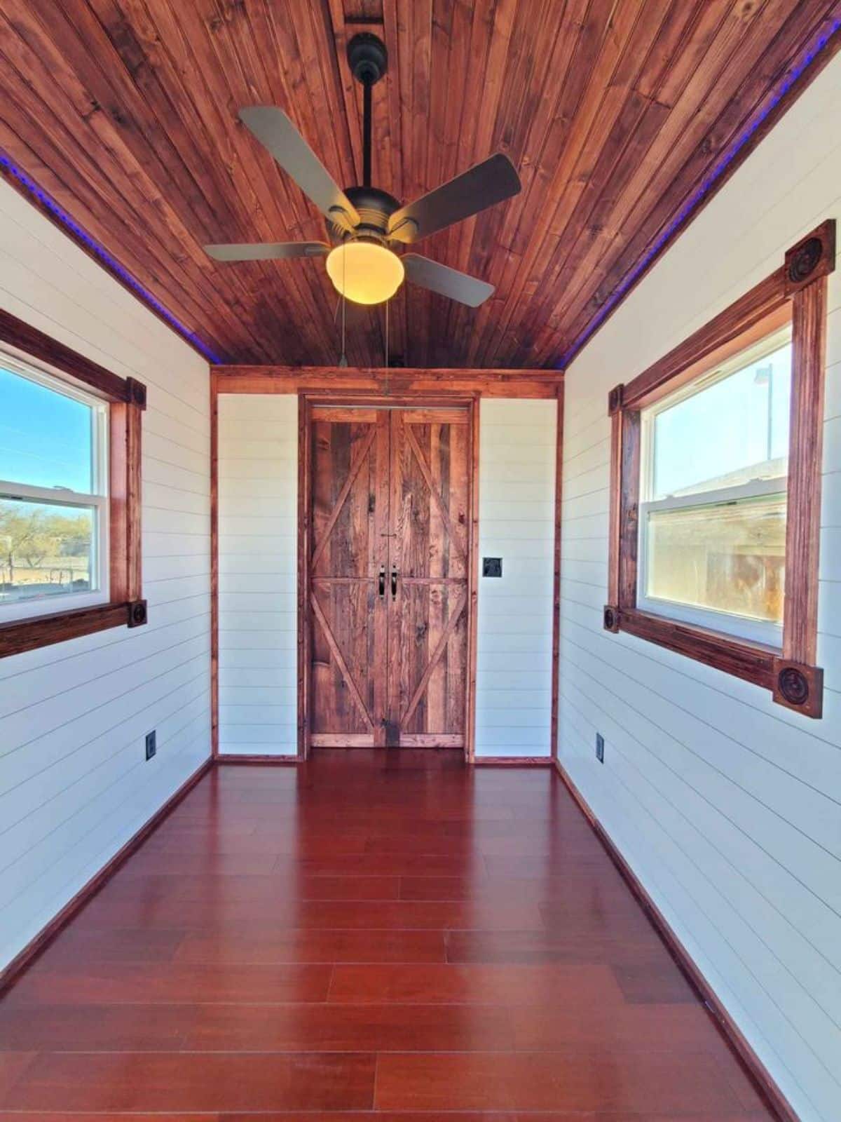 open space with back door can be the living cum downstairs bedroom of 24' tiny home on wheels