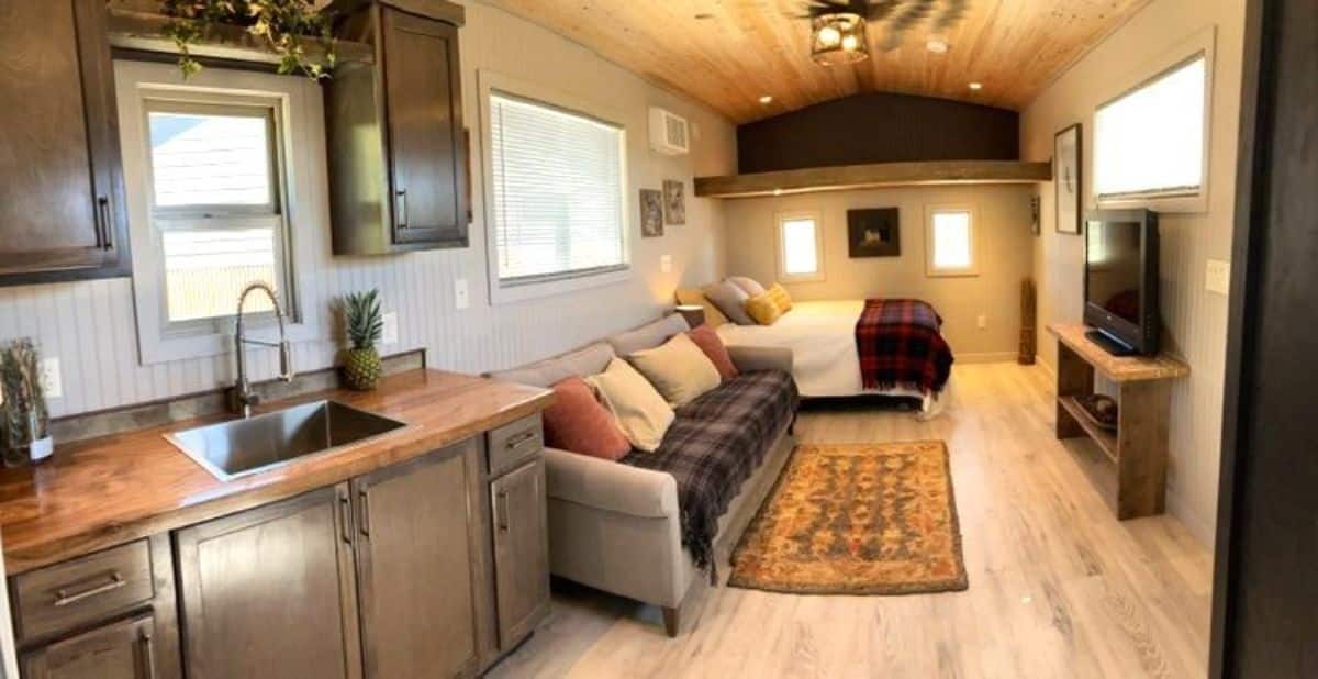 full length interiors of custom mobile home from main door view