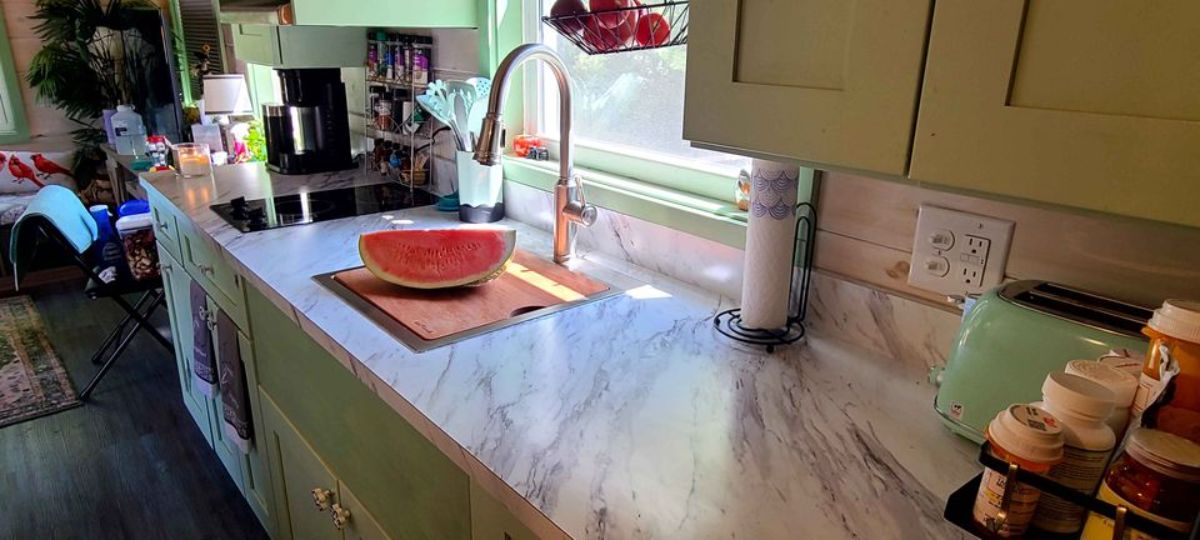 marble countertop in kitchen with storage cabinets
