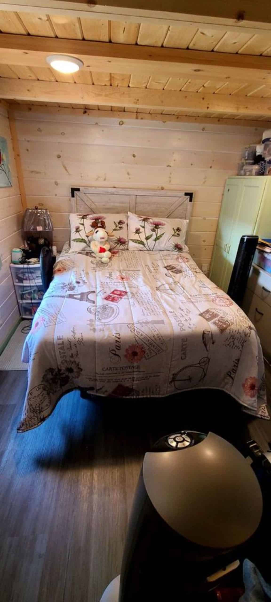 double door bed in the bedroom of mountain tiny home