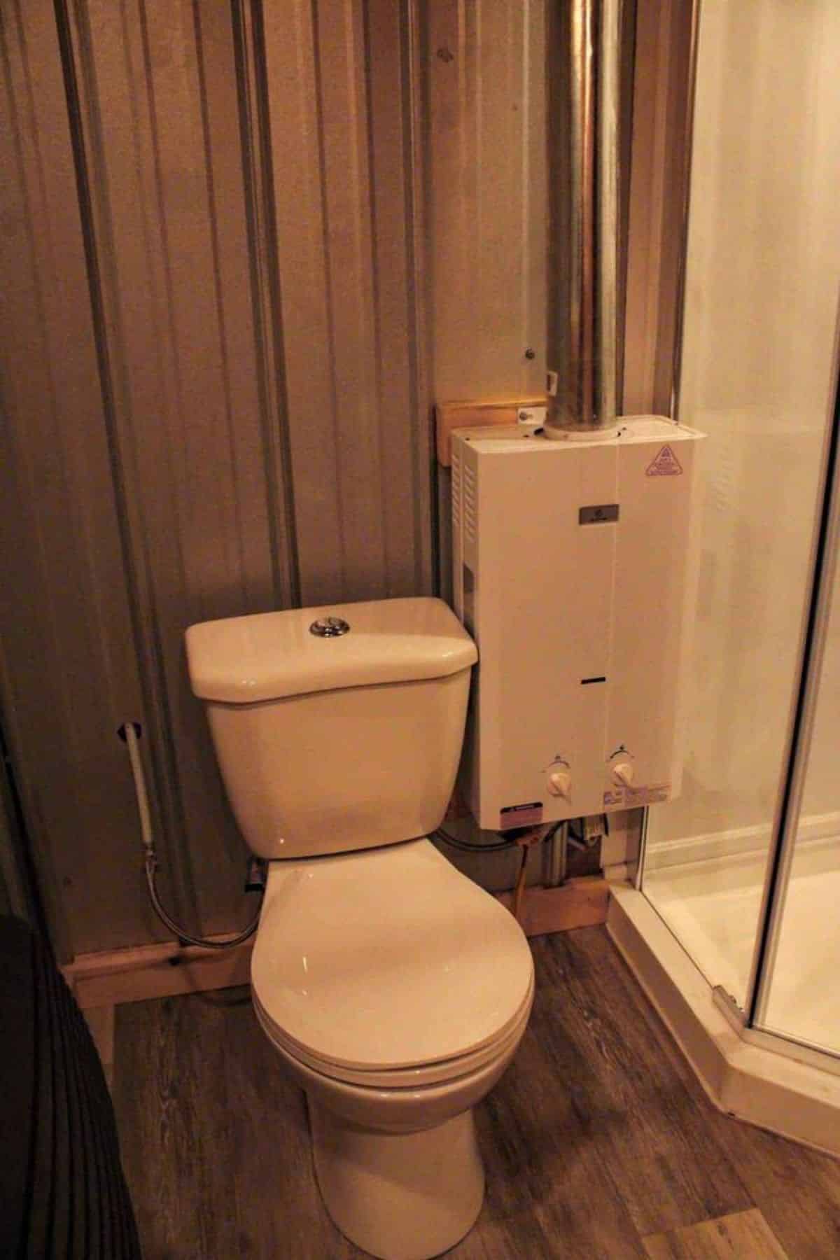 standard toilet in bathroom of beautiful tiny house