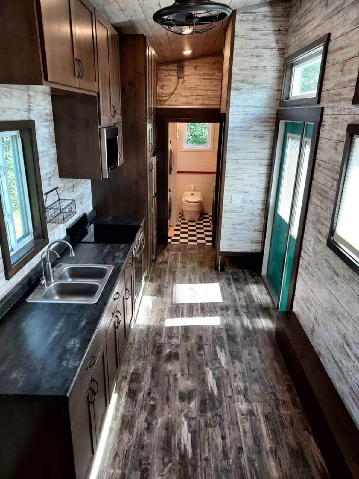 full length interiors and kitchen view of tiny home in Minnesota