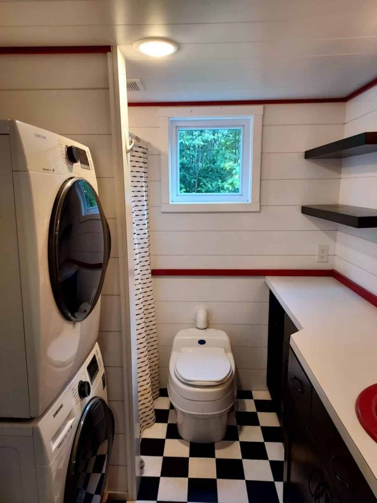 bathroom of tiny home in Minnesota has all the standard fittings with shelves
