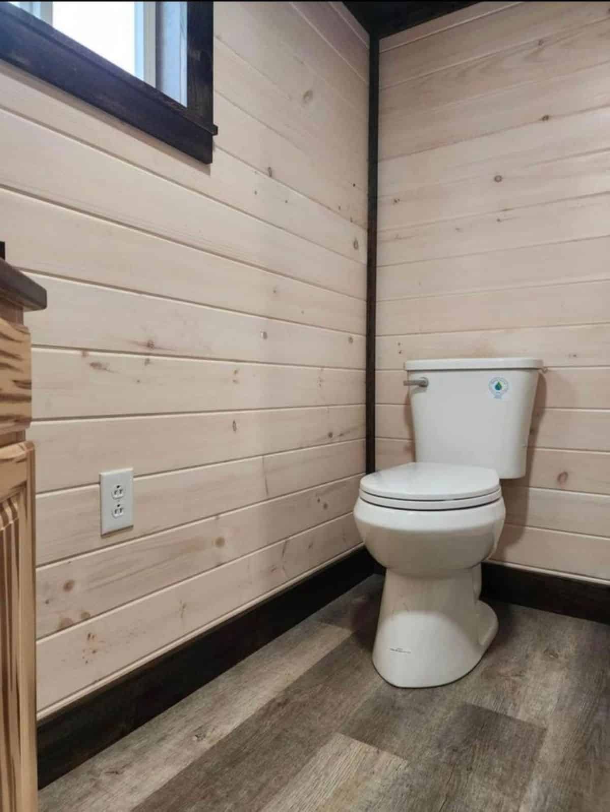 standard toilet in bathroom of spacious tiny home