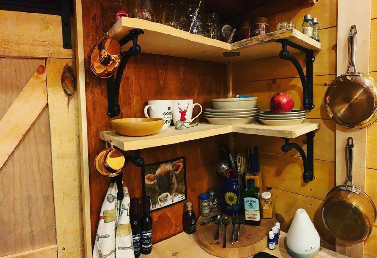 shelves in the kitchen area of handcrafted tiny home