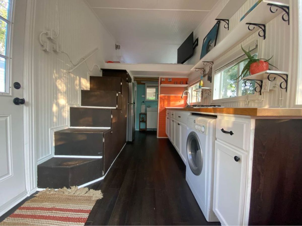 full length interiors of 20’ tiny home from living room view