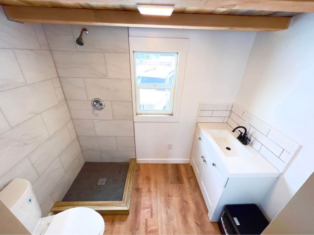 bathroom of rustic mini home has all the standard fittings