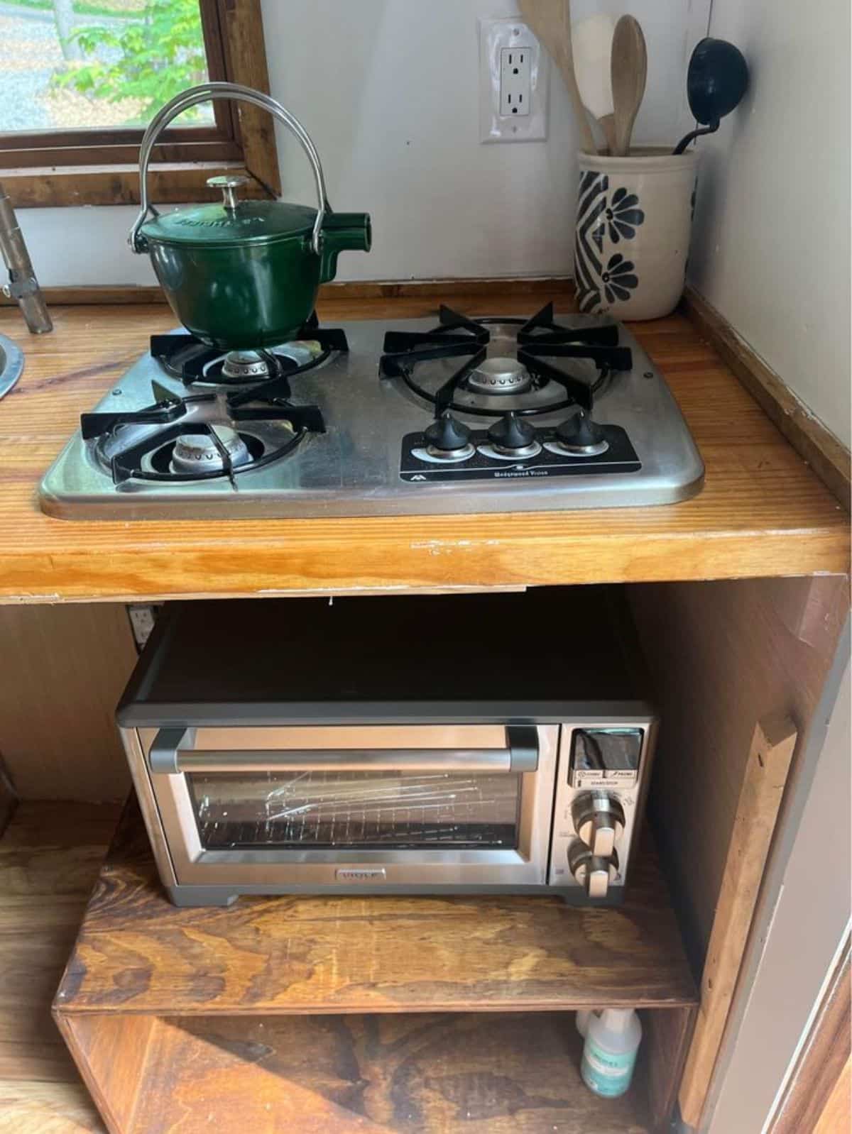 downsized appliances in kitchen area of fully insulated tiny home
