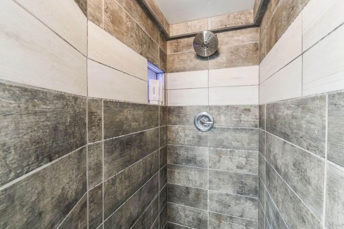 full tiled shower area in bathroom