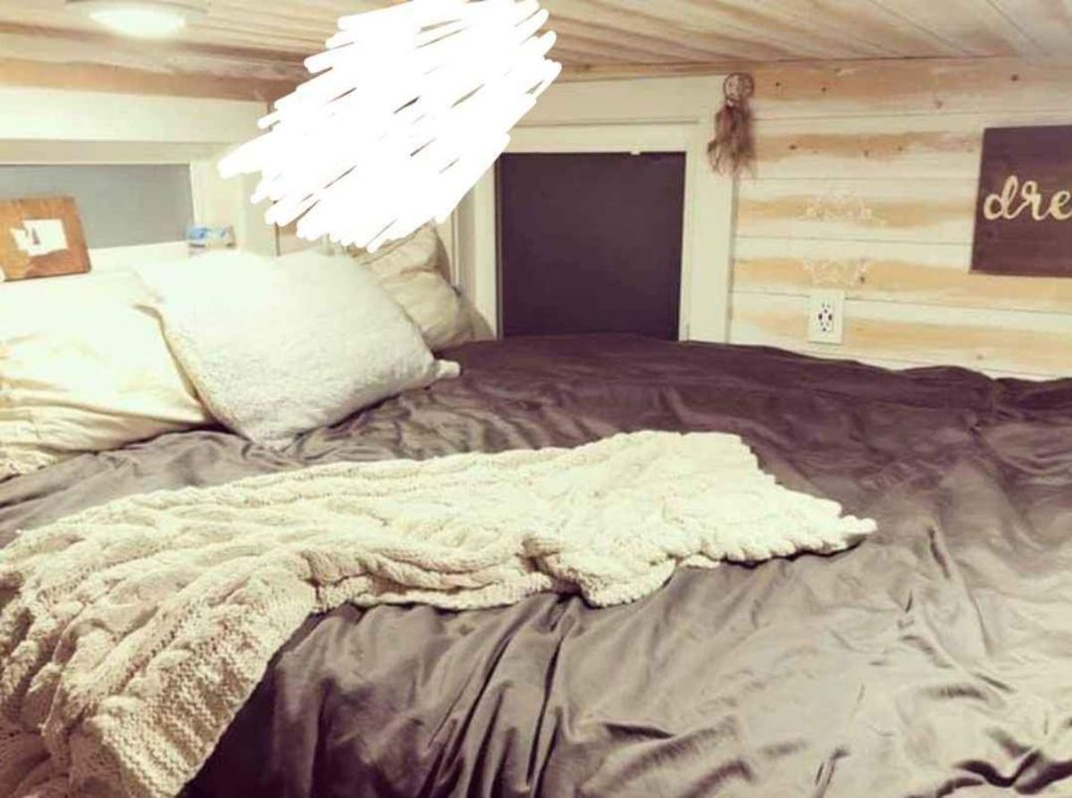 loft bedroom of super tiny mobile home is comfortable with bed