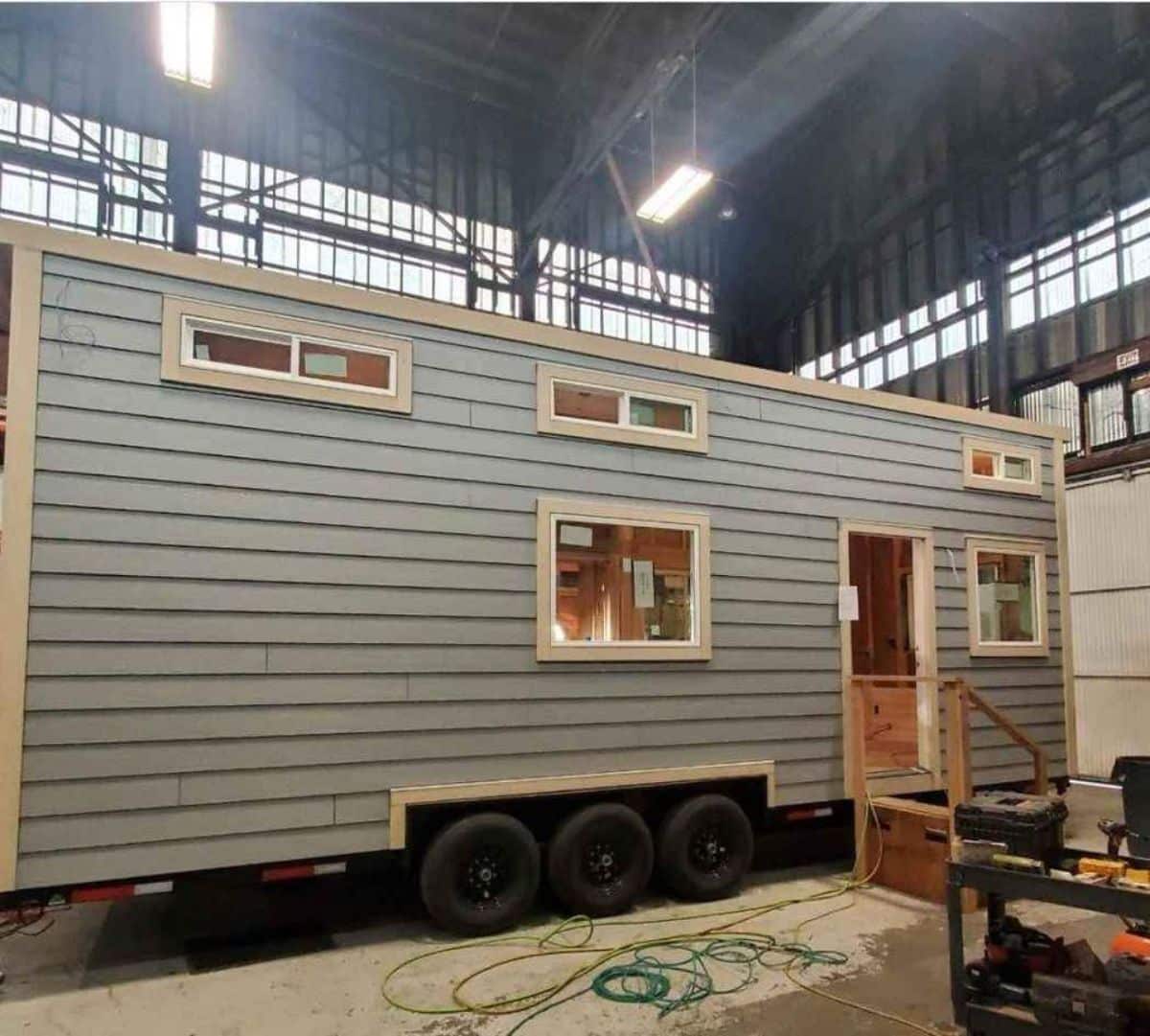 stunning gray exterior of super tiny mobile home