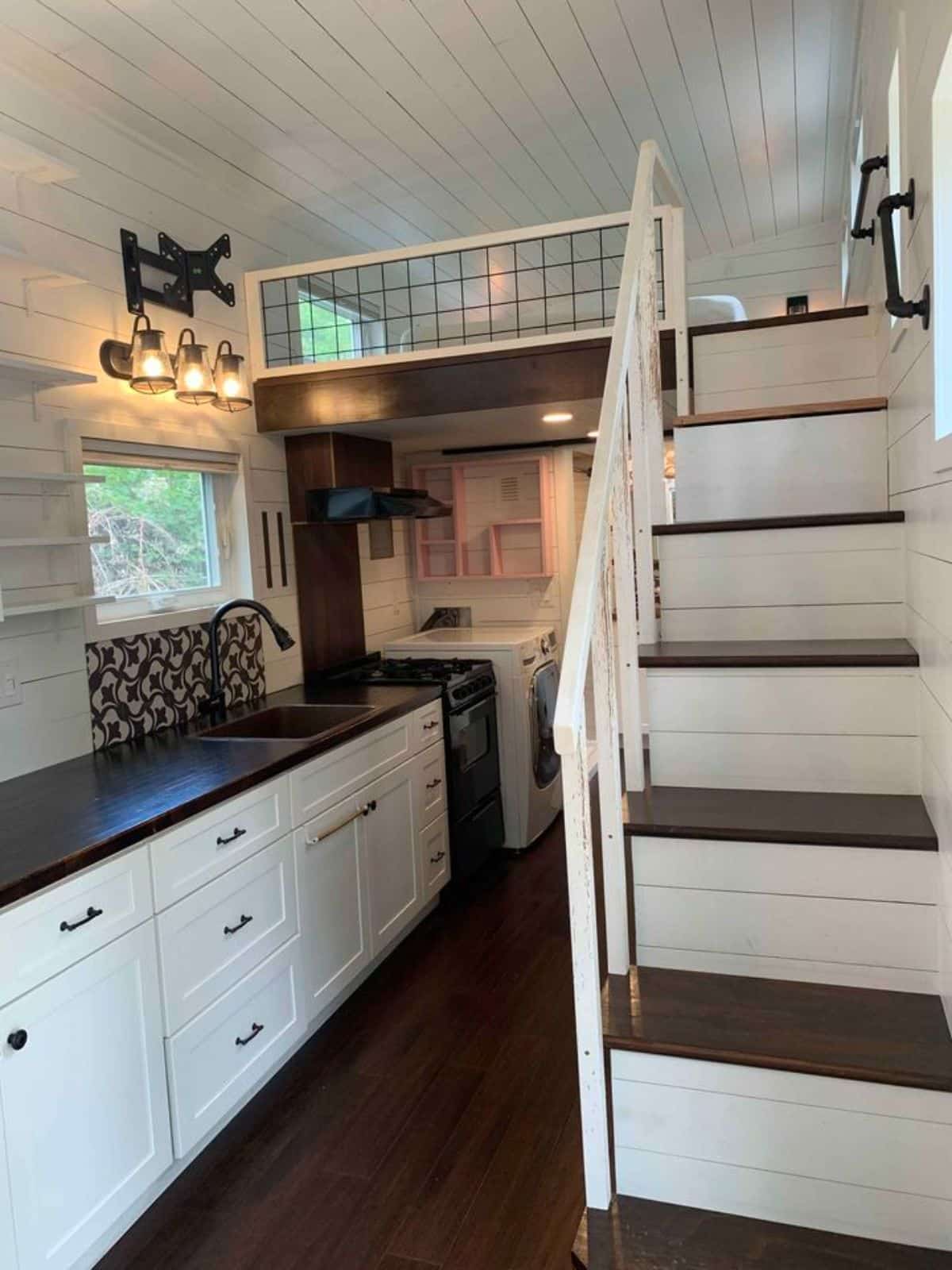 stunning interiors of 24’ tiny home with deck
