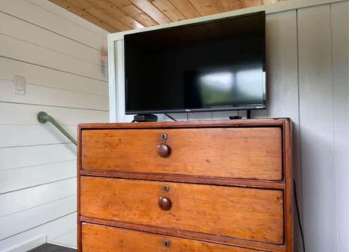 wall mounted TV set with an entertainment unit