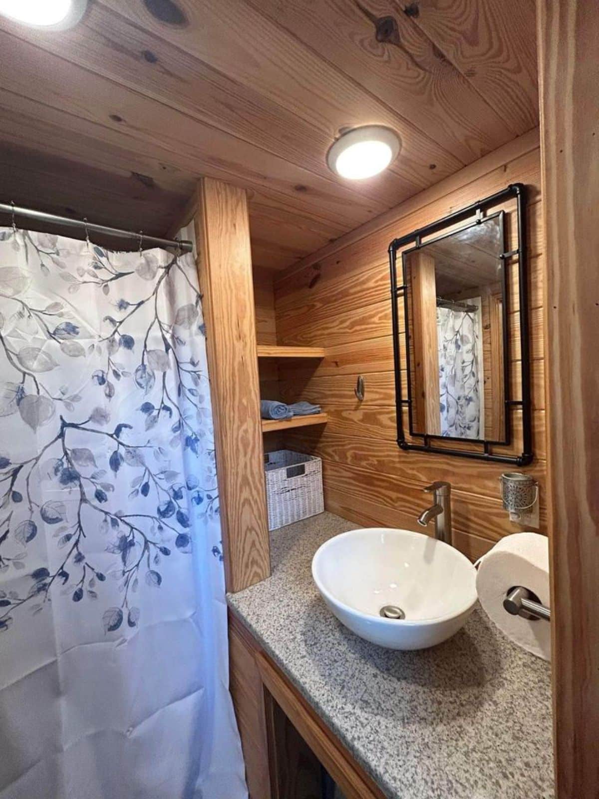 sink with vanity and mirror in bathroom