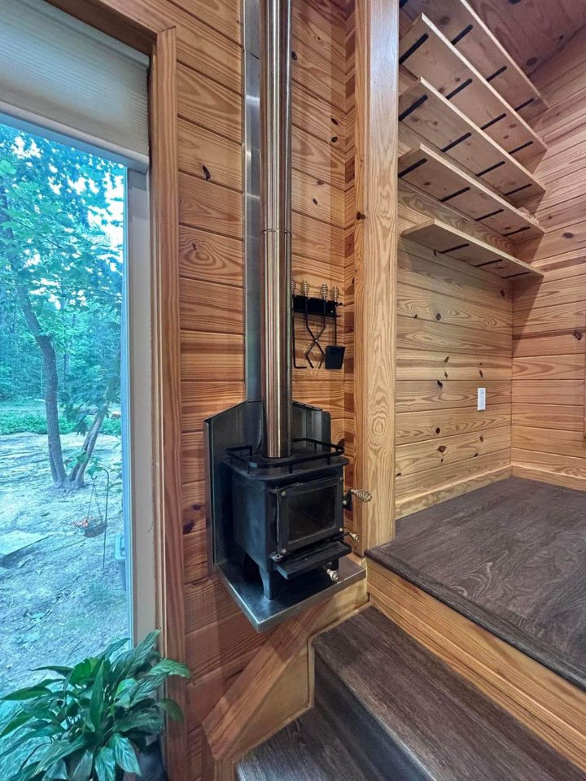 fireplace in the living area of 26’ custom tiny home