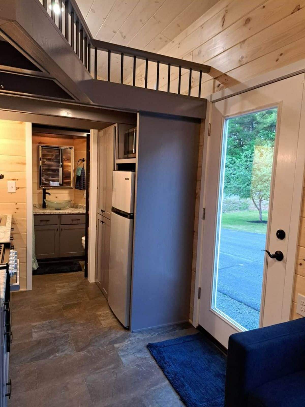 main entrance view of 30’ tiny house on wheels from inisde