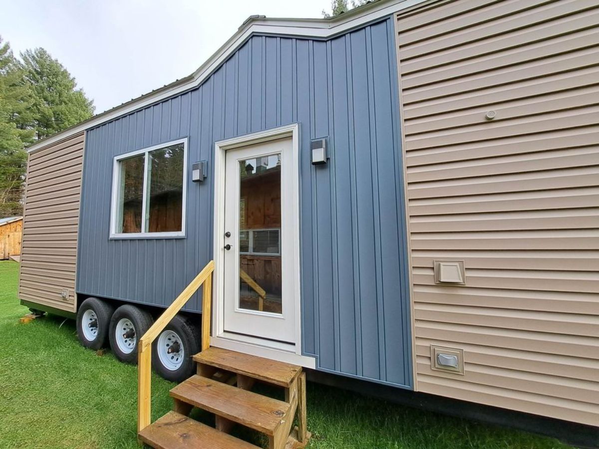 main entrance and stunning exterior of 30’ tiny house on wheels