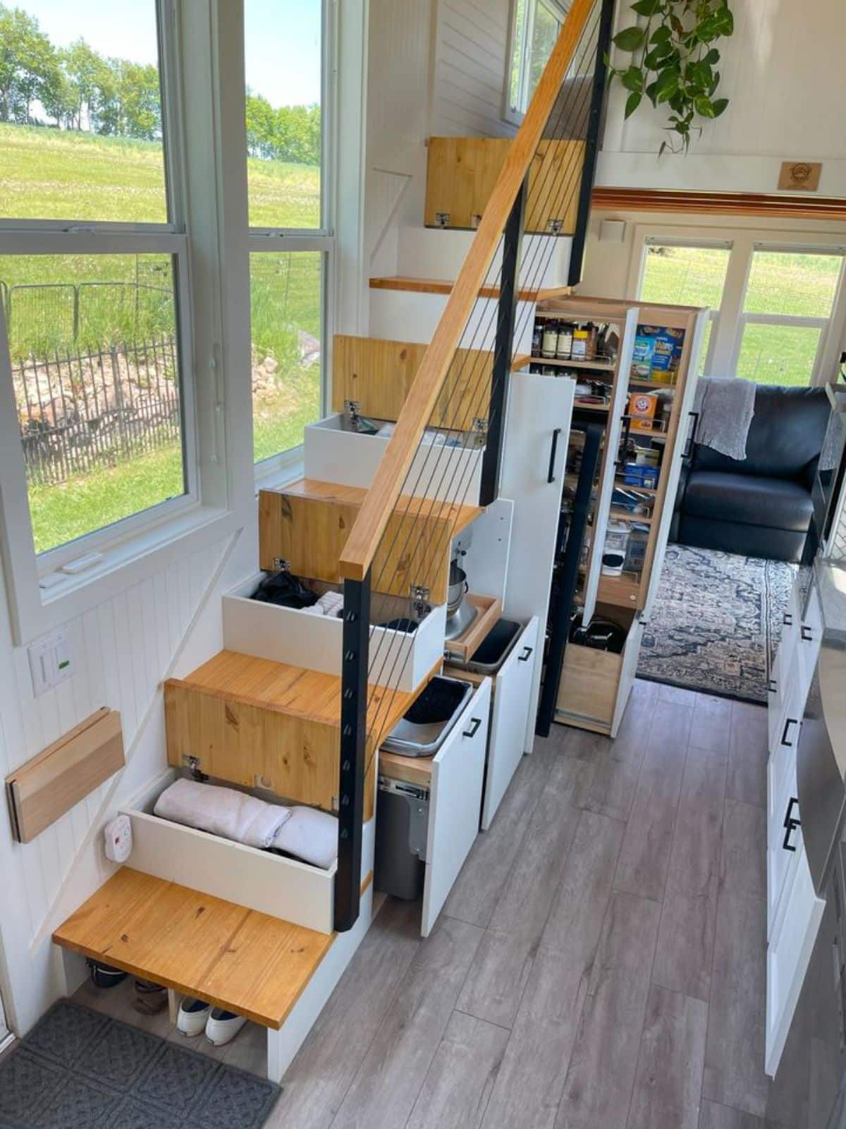 multi purpose stairs leading to the main loft of 30’ two bedroom tiny home