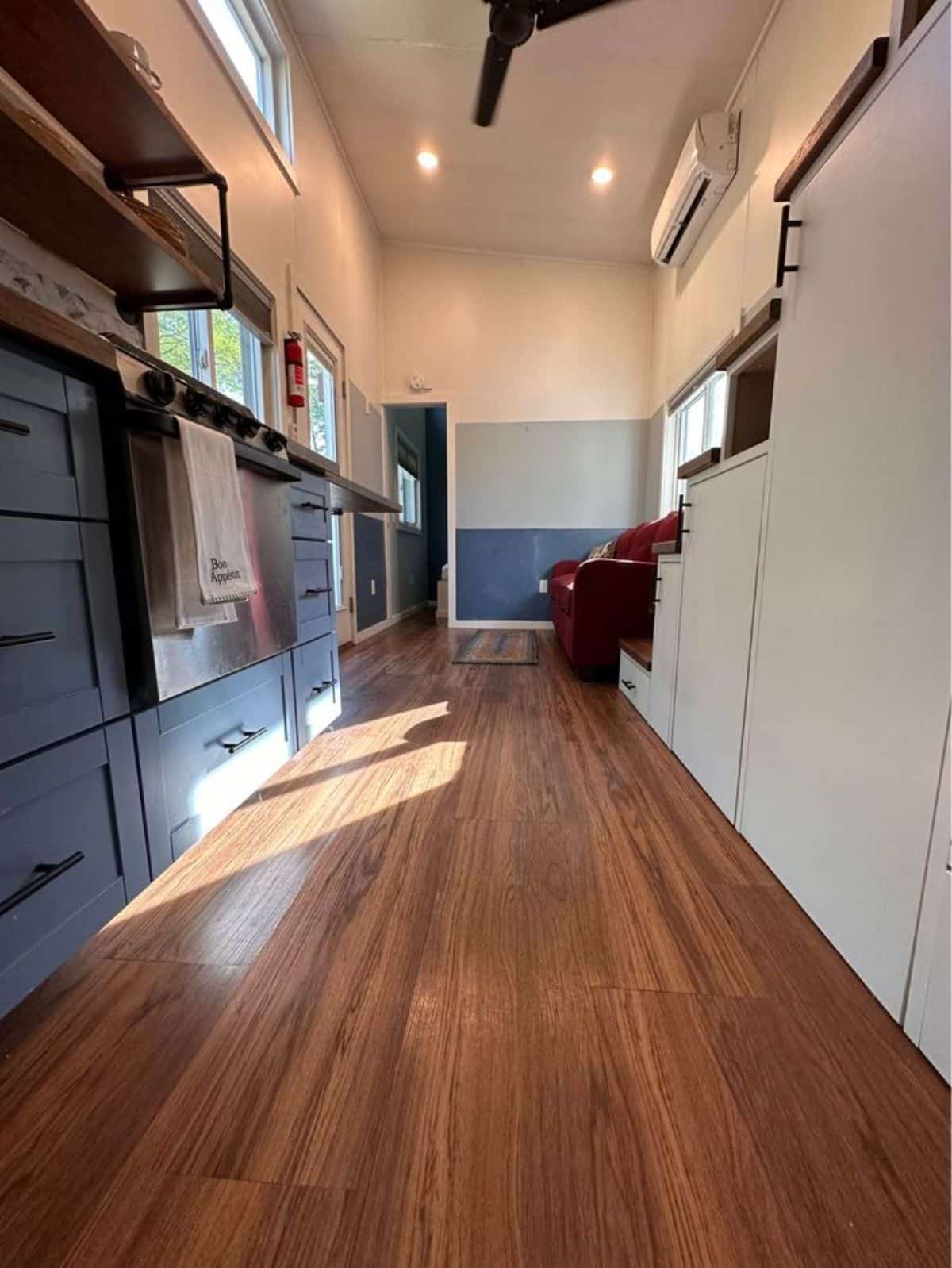 storage cabinets in the kitchen area of 32' tiny home for four