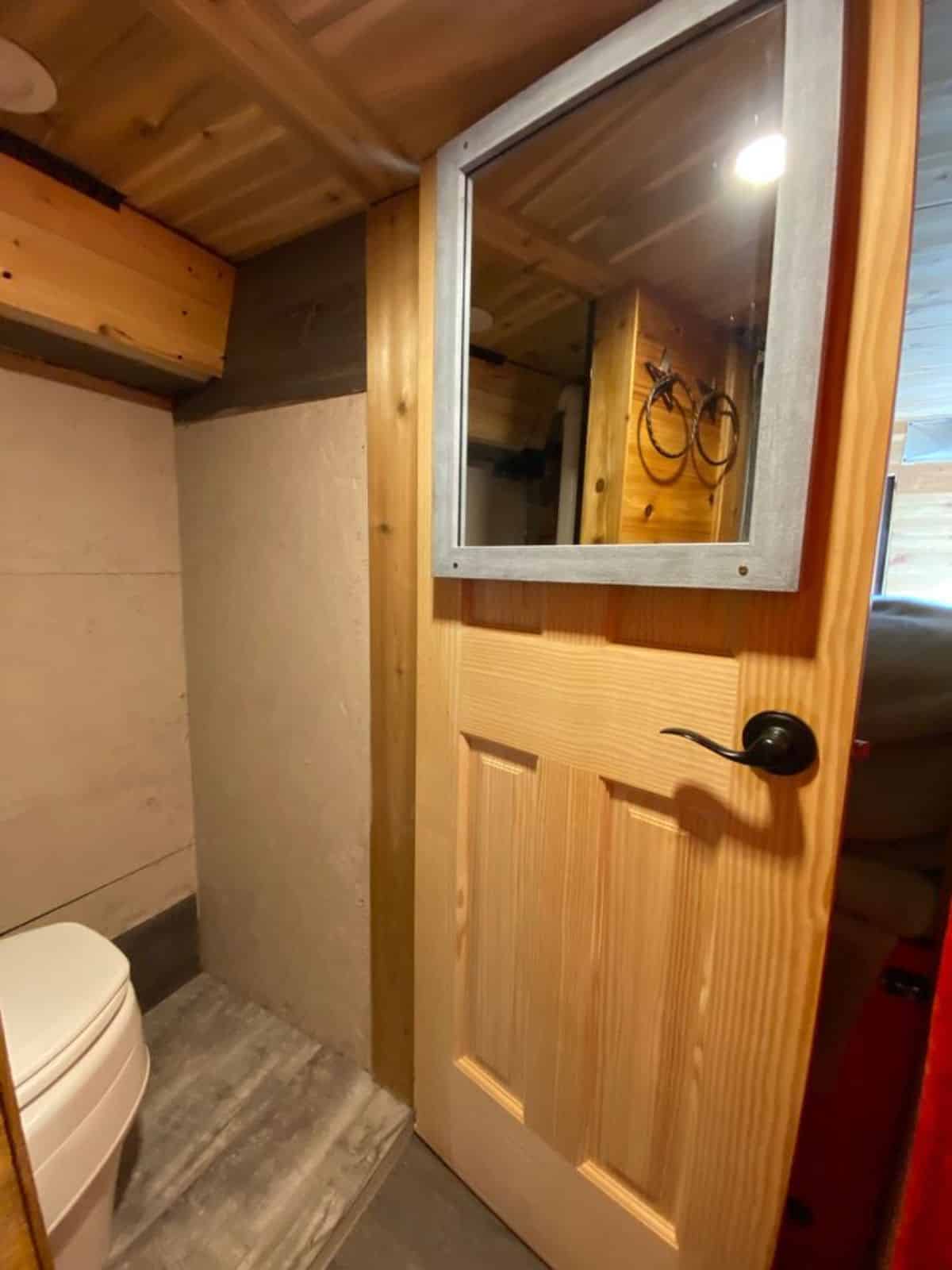 bathroom of converted tiny home has all the standard fitings