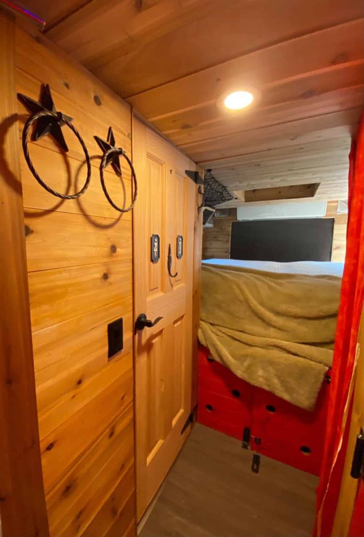 huge comfortable bedroom on the end of converted tiny home