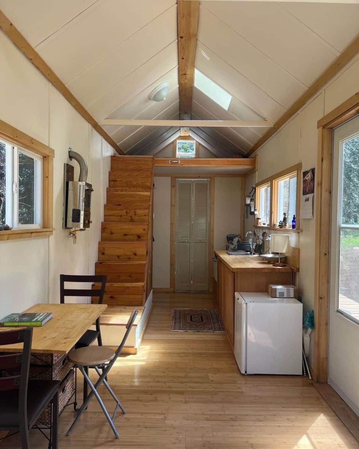 full length furnished view of beautiful tiny house from inside