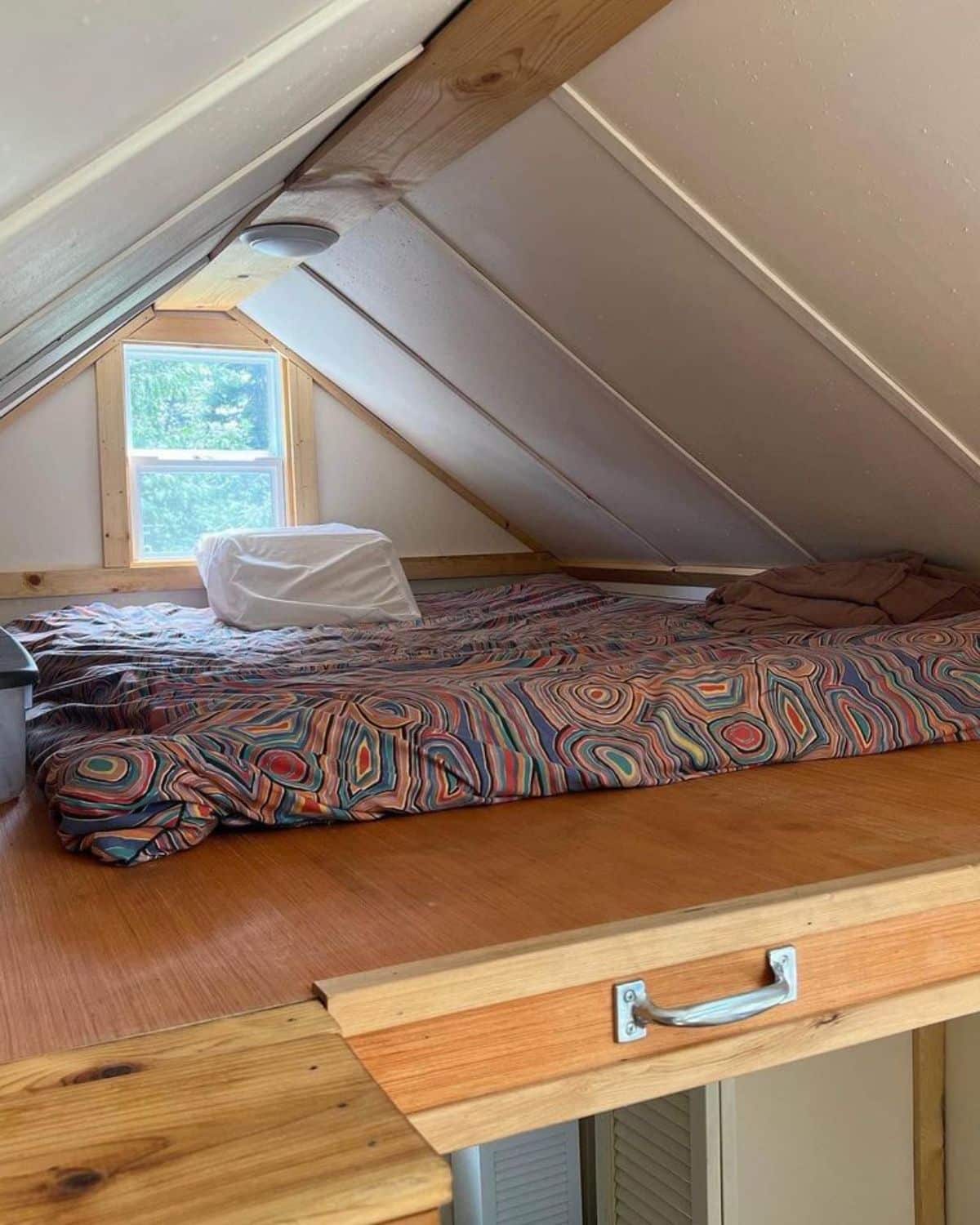 loft bedroom of beautiful tiny house is superb with comfortable mattress