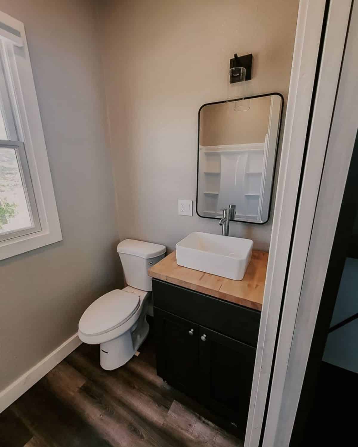 bathroom of 20’ tiny house on wheels has all the standard fittings