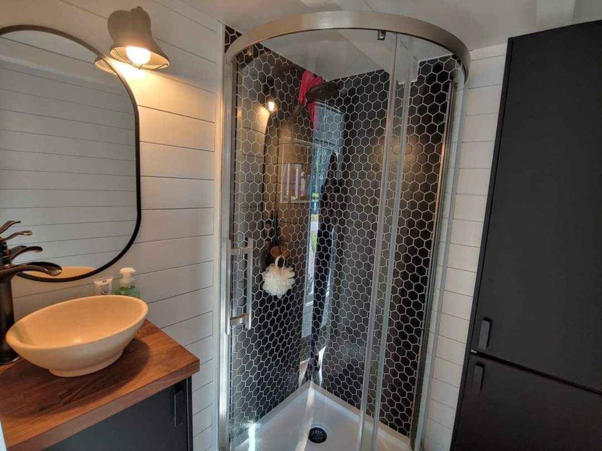 bathroom of custom built tiny home has all the standard fittings