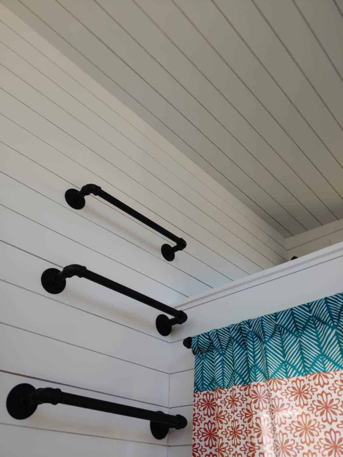 stylish ladder leading to the 2nd loft of custom built tiny home